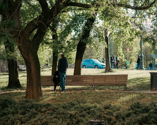Man taking a short relaxing walk after work in a city park in Hungary
